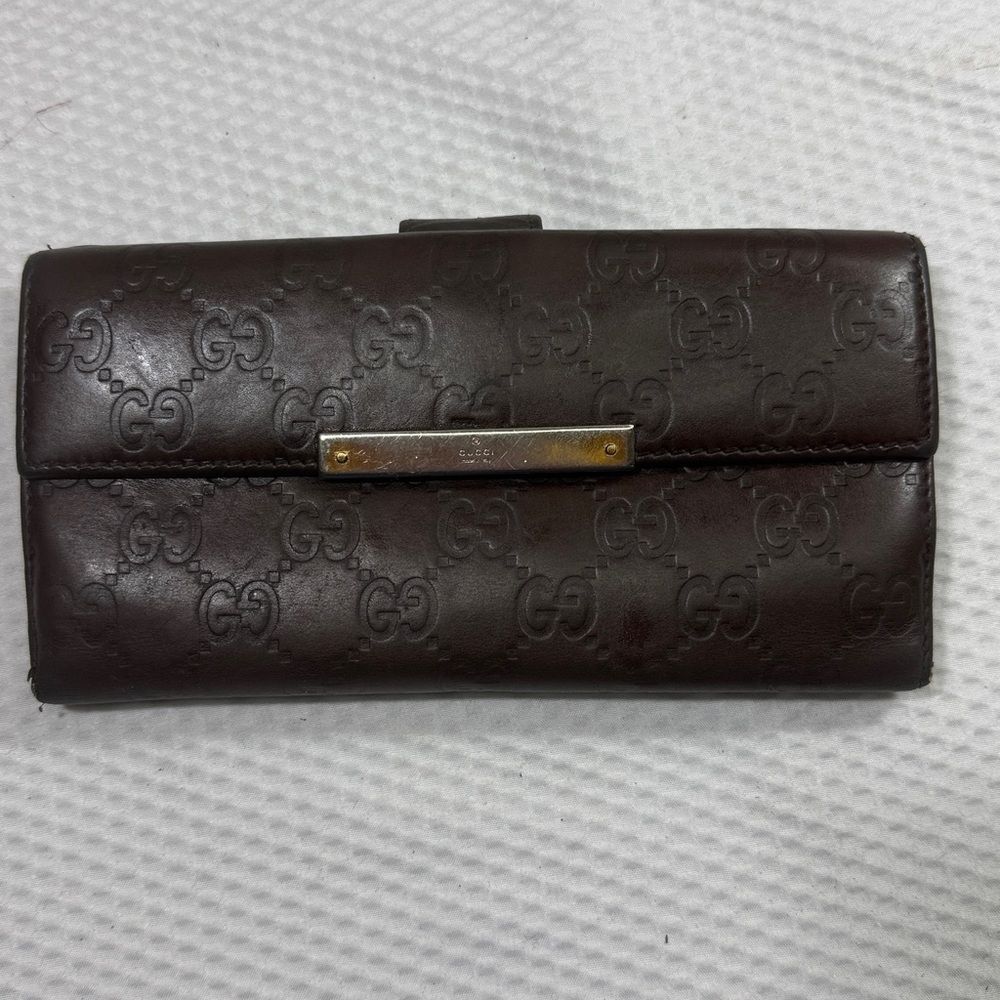 Gucci Dark Brown Embossed Clutch wallet inside is clean. GUC much life left!